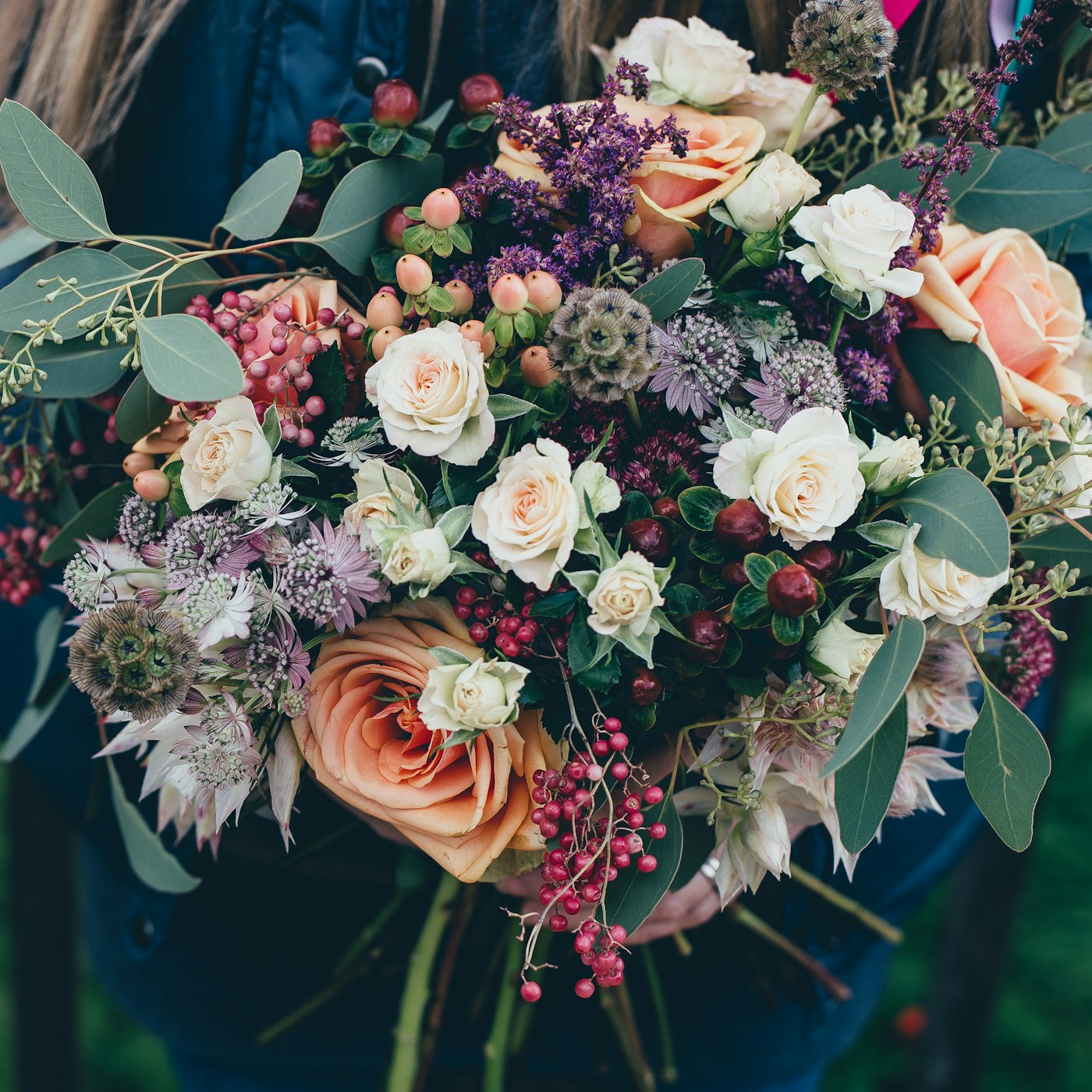 A mixed bouquet of roses and garden flowers
